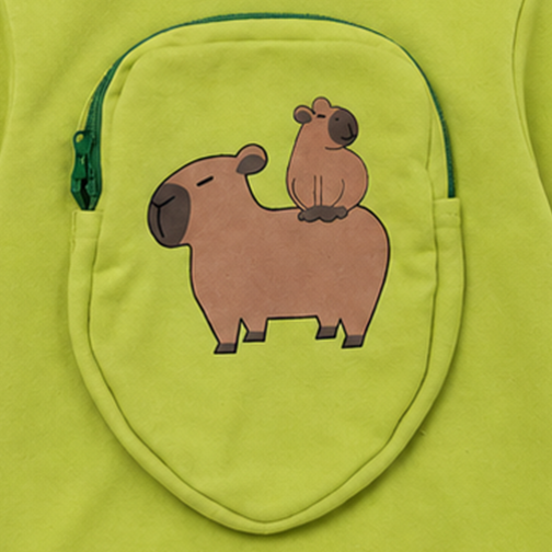 Close-up of green zippered back pocket with baby capybara sitting on adult capybara illustration