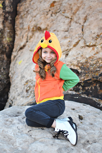 Child in the rooster hoodie, hands on hips