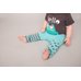 Picture of Baby, Person, Clothing, Pants, Finger, T-Shirt with text ell.