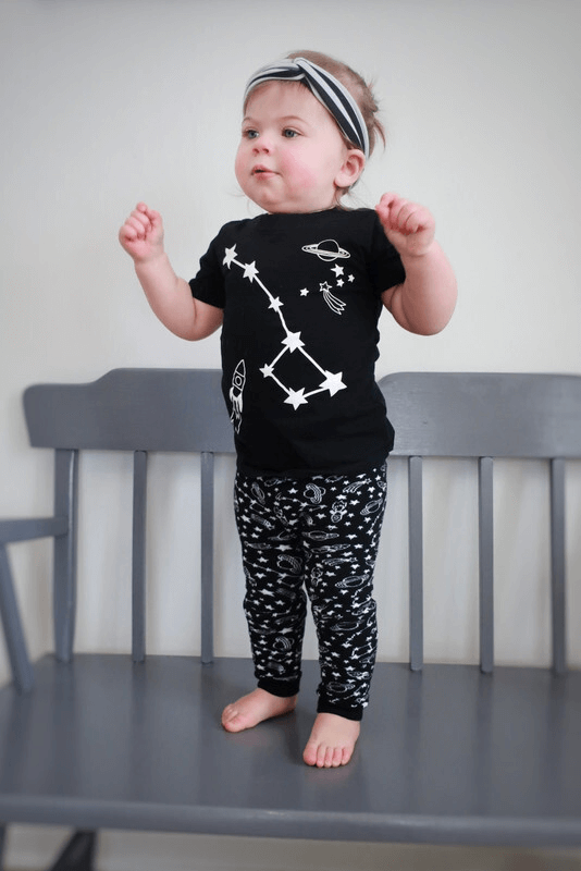 Toddler wearing black constellation t-shirt with space print leggings