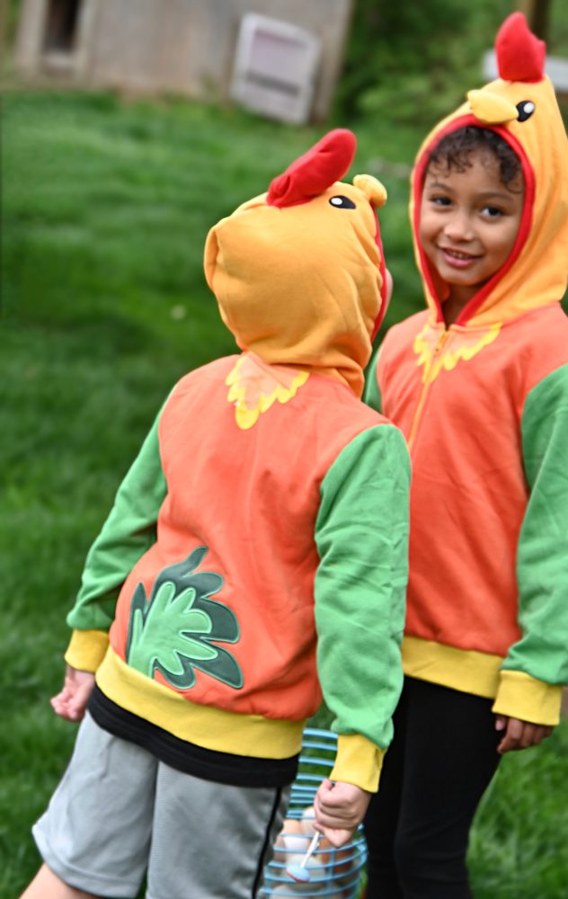 Two kids, one showing the tail on the back