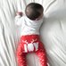 Picture of Baby, Person, Cushion, Home Decor, Pants with text JOY.
