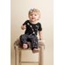 Picture of Face, Person, Photography, Portrait, Finger, Sitting, Pants, Baby, Furniture, Bar Stool