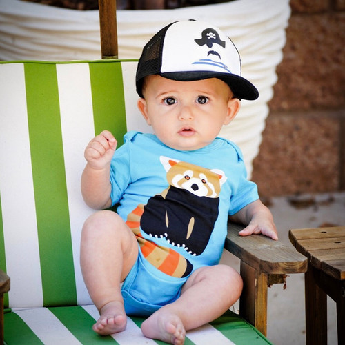 Picture of Baseball Cap, Cap, Hat, Person, Photography, Portrait, T-Shirt, Baby, Sitting, Furniture