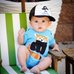 Picture of Baseball Cap, Cap, Hat, Person, Photography, Portrait, T-Shirt, Baby, Sitting, Furniture