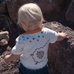 Picture of T-Shirt, Rock, Pants, Person, Photography, Portrait, Baby, Soil, Jeans