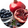 Fresh blueberries and sliced pomegranate with seeds, circular crop