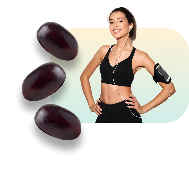 Woman in athletic wear with phone armband and green supplement gummies