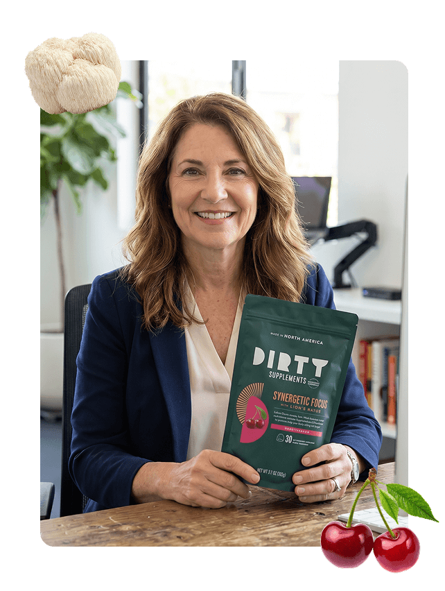 Woman in blue blazer holding DIRTY Supplements Synergetic Focus with Lion's Mane Tart Cherry mushroom gummies pouch in an office setting
