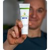 Picture of Finger, Person, Hand, Lotion, Bottle, Cosmetics, Sunscreen, Face with text CBDPure CBD In...