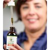 Picture of Woman, Adult, Female, Person, Face, Head, Finger with text CBDPure HEMP OIL 300 DIETARY S...