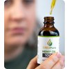 Picture of Face, Person, Man, Adult, Male, Finger, Bottle with text CBDPure HEMP OIL 100 - DIET HEMP...