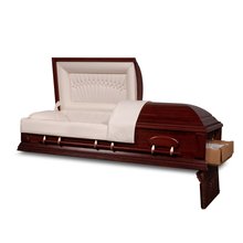 An angled view of an open, empty ceremonial rental casket placed on a white background. The rental casket features a rich, dark finish with a satin sheen, and is adorned with metal swingbar handles on its sides. The interior head panel is lined with a plush, tufted fabric in a light beige color. The end door is open to reveal the corrugated fiberboard rental casket insert.
