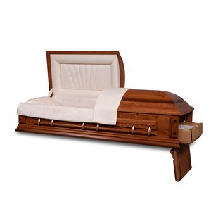 A front perspective view of an open, empty casket on a dark background. The casket is made of a rich, reddish-brown wood with a polished finish, giving it an air of classic elegance. The casket's lid is open at the head, revealing a white satin interior with a tufted design on the head panel. Silver-tone stationary bar handles are attached to the sides, providing a contrast to the warmth of the wood.